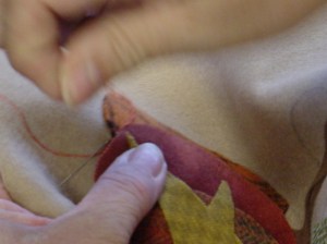 Then take a button hole stitch